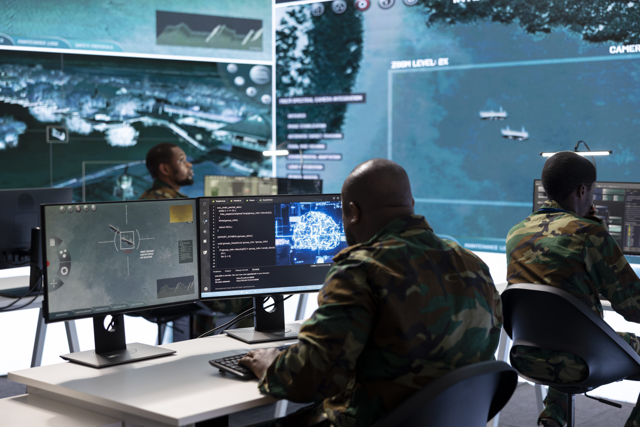 Military specialist in high tech control center managing satellite surveillance