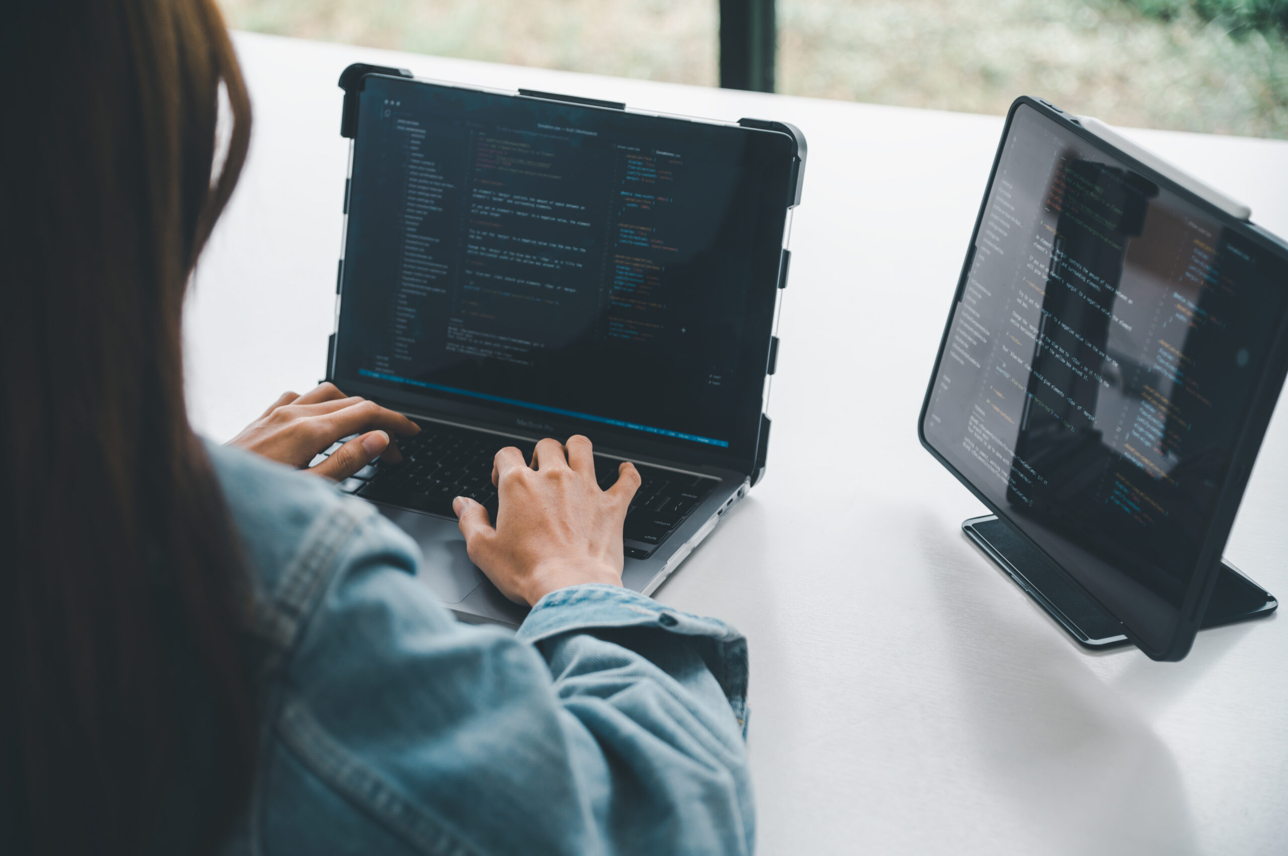 Female programmer working on coding, software development and we