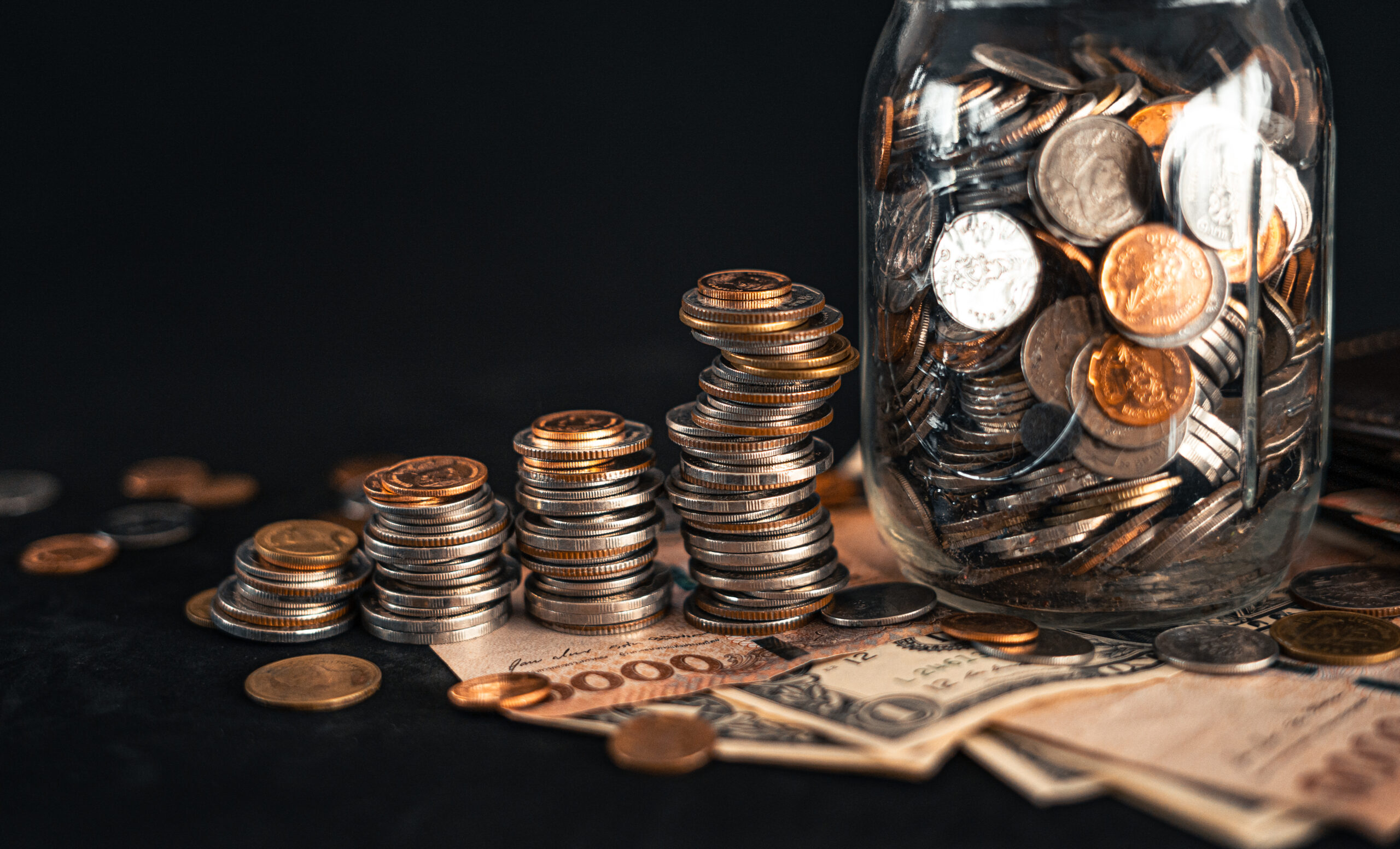 Stacked money grow on a black background