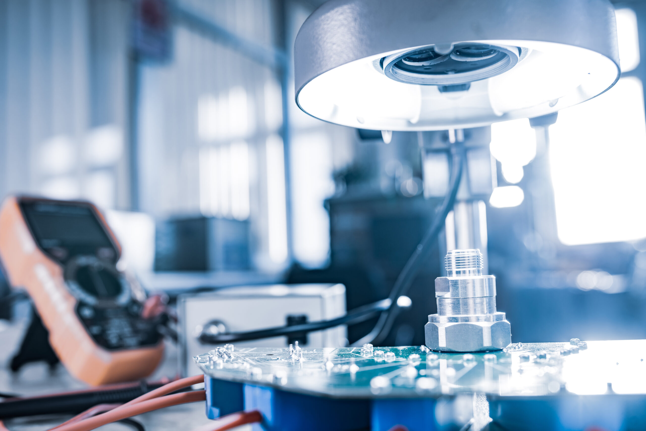 Modern microscope, connectors component and large green microcircuit in workshop laboratory