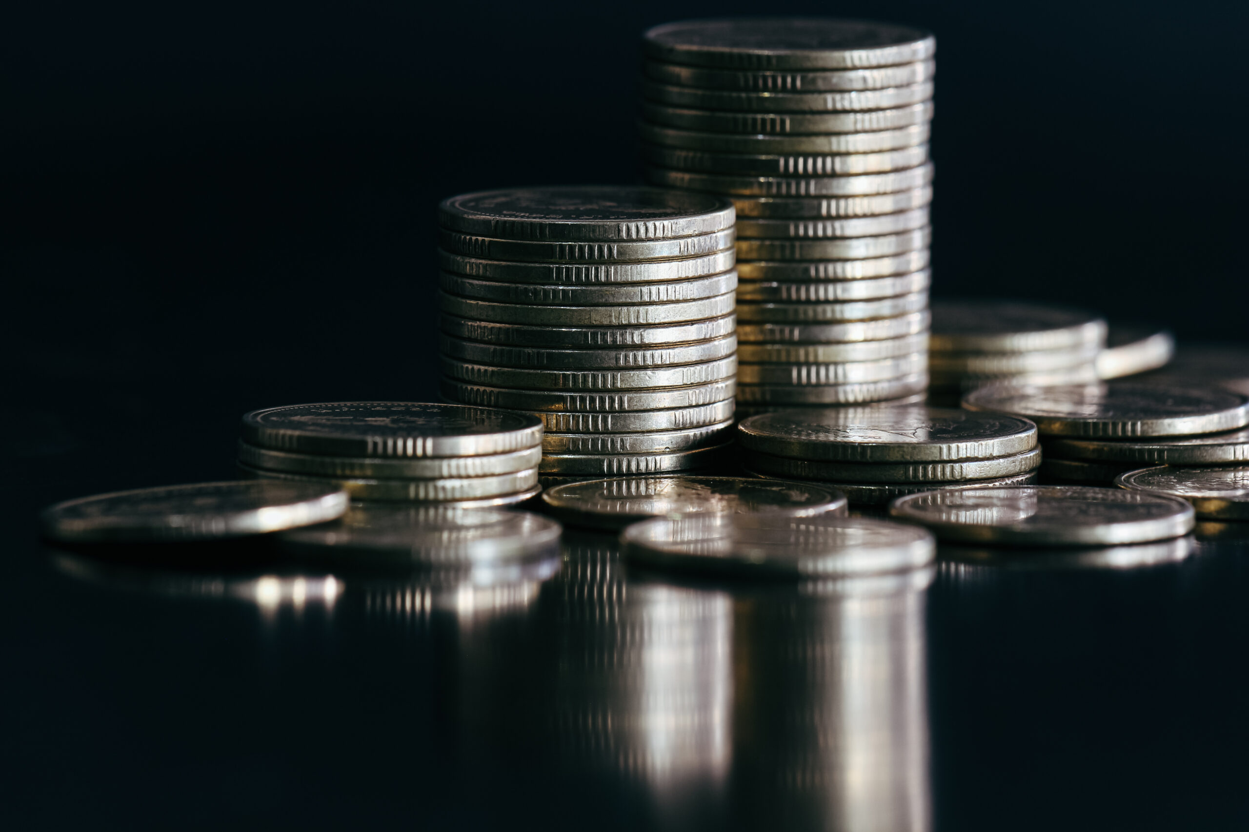 close-up-of-silver-money-coin-stack-on-black-backg-2026-03-17-05-50-17-utc