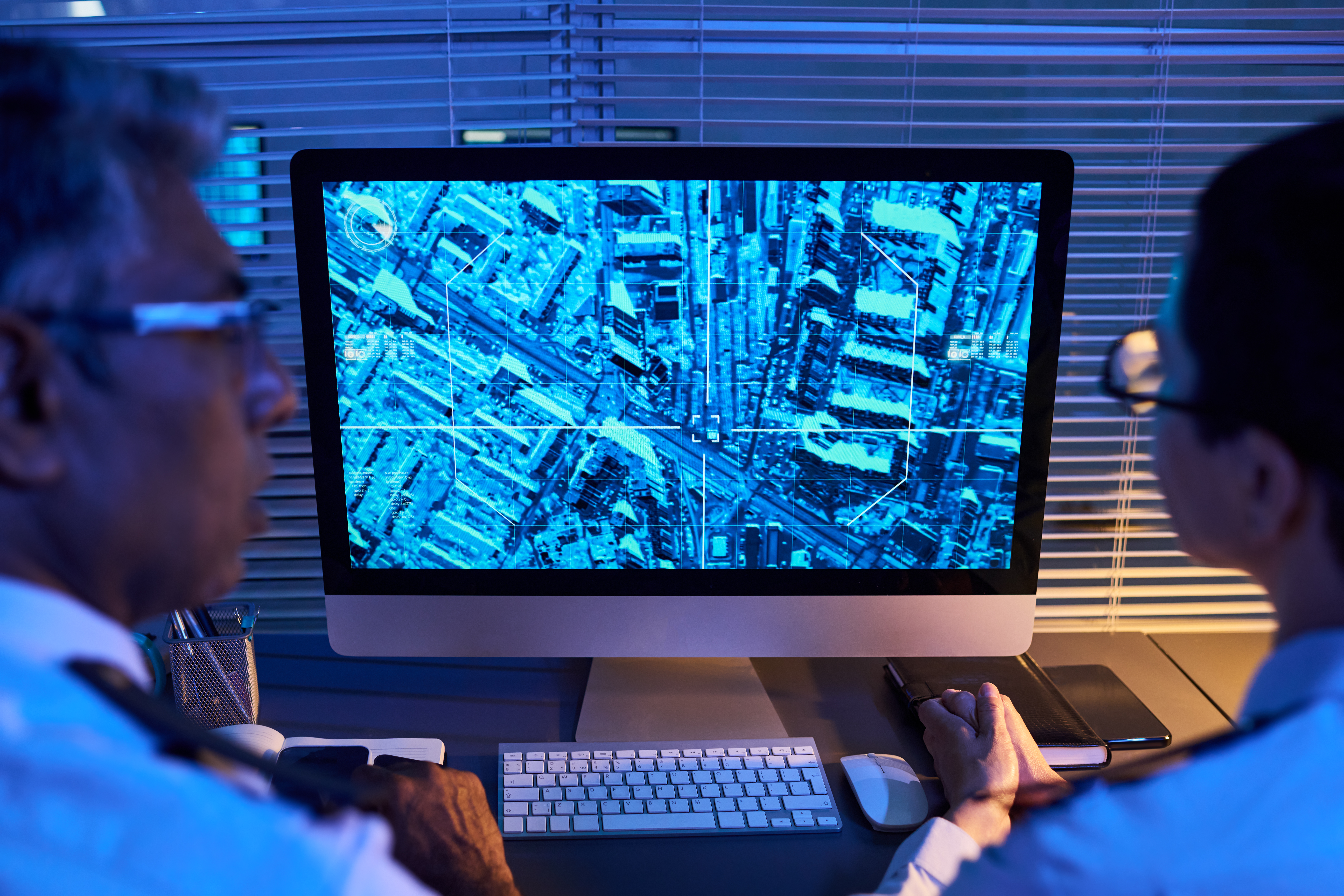 Security Officers Monitoring City Surveillance Map on Computer Screen